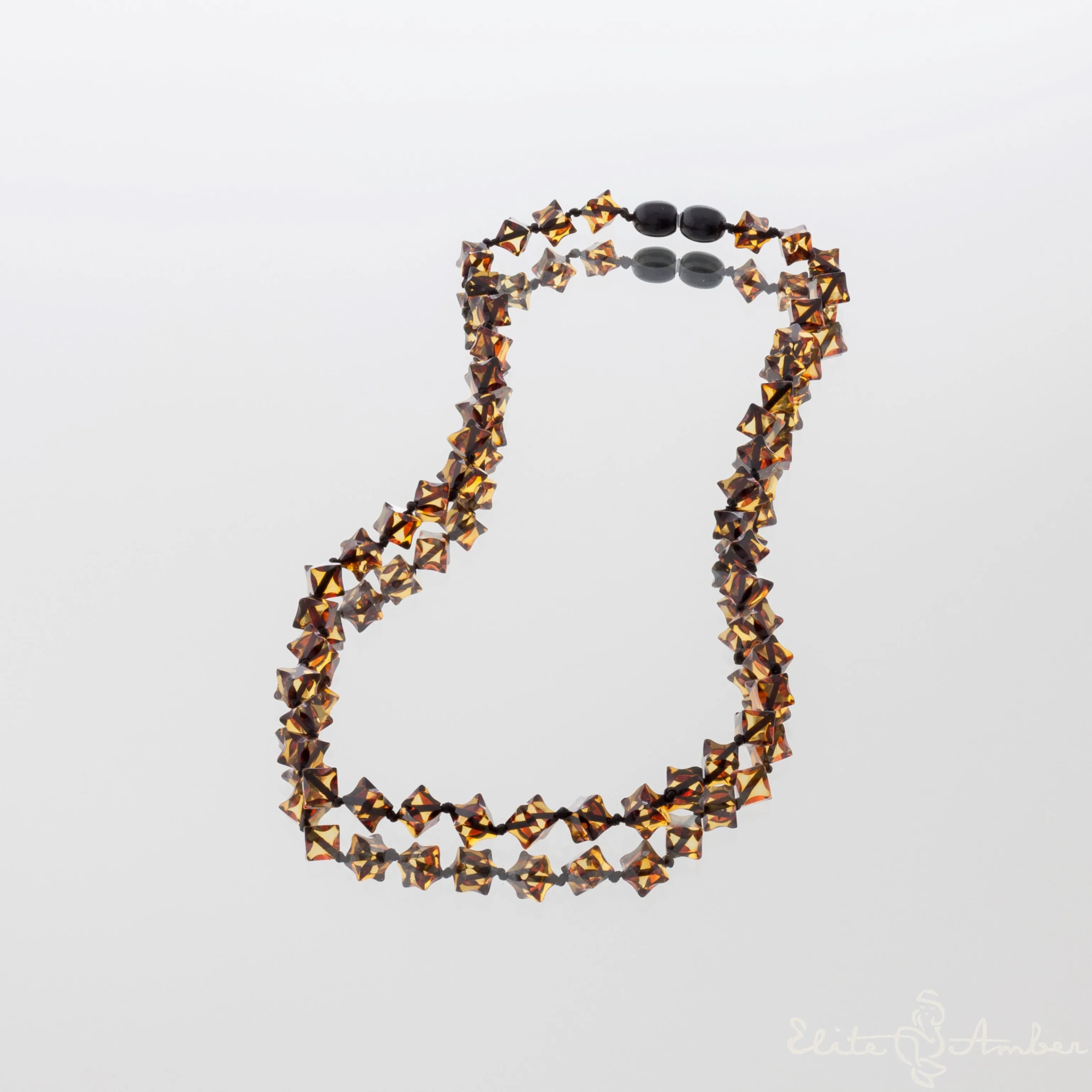 Amber necklace "Glossy black star"