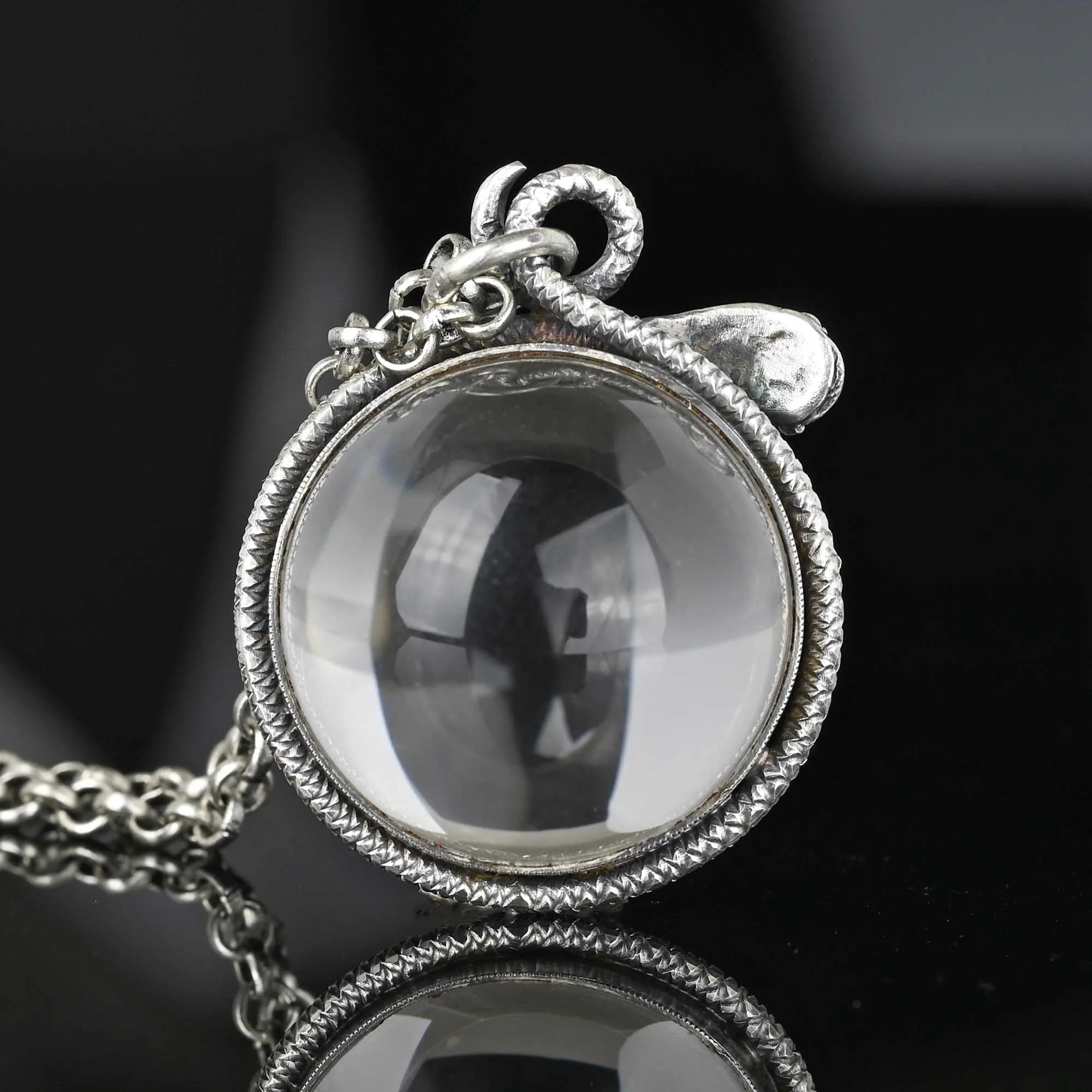 Art Deco Pools of Light Rock Crystal Coral Snake Pendant