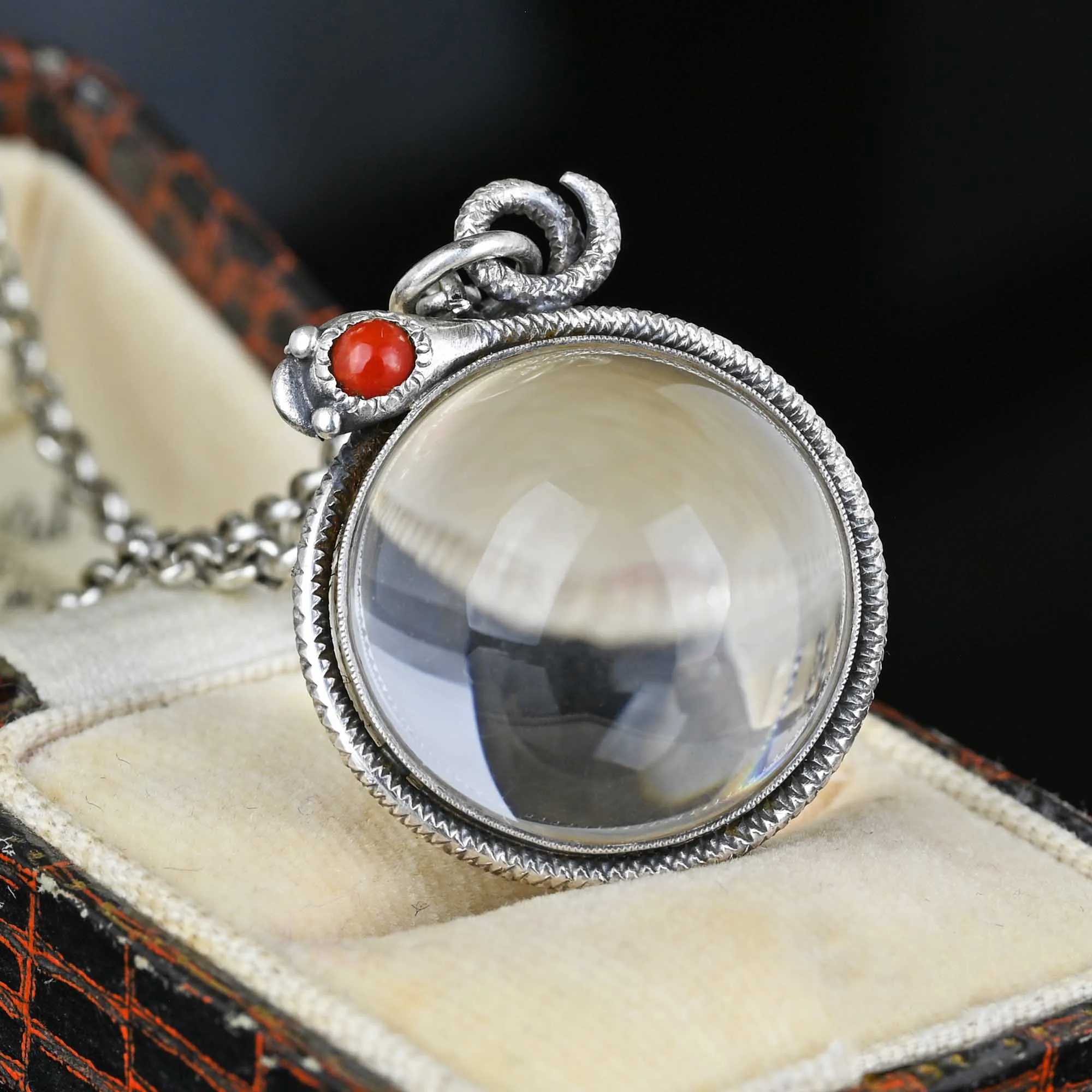 Art Deco Pools of Light Rock Crystal Coral Snake Pendant